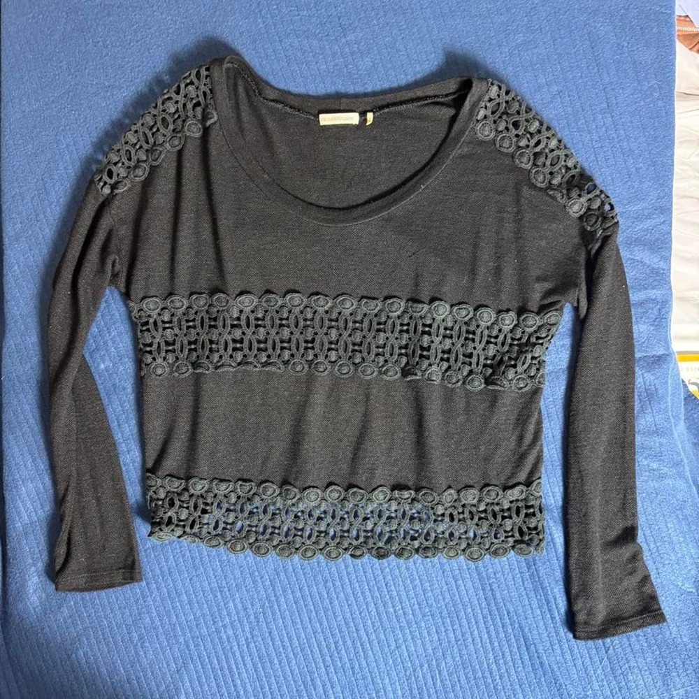 Black long sleeve top with lace trim and cutouts